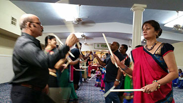 photo shows people at a gathering at the Gujarati Samaj.